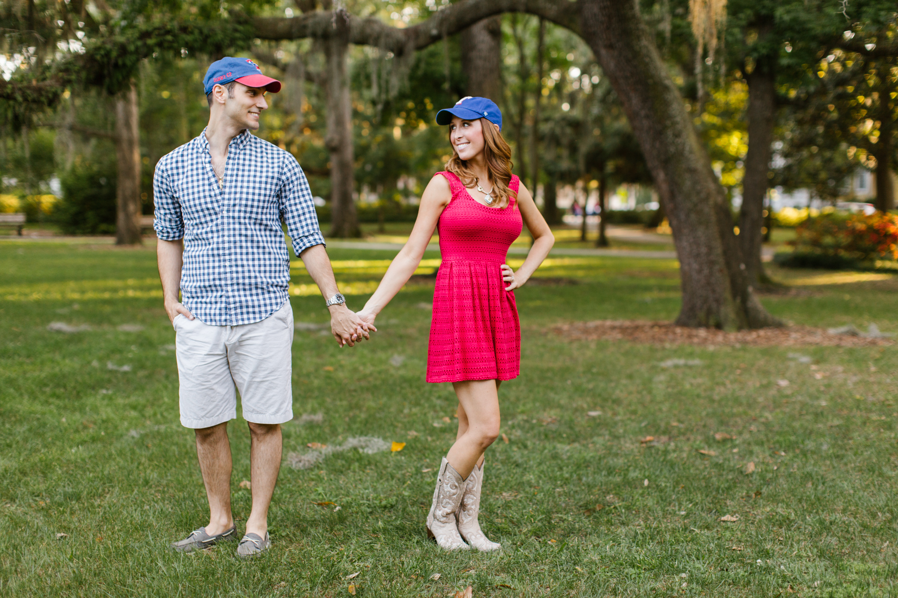 Couple standing with hats on